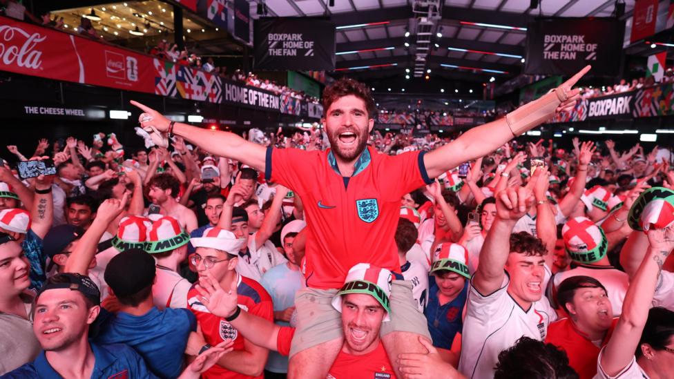 A huge crowd celebrating during a showing of the match at Wembley's boxpark bar.