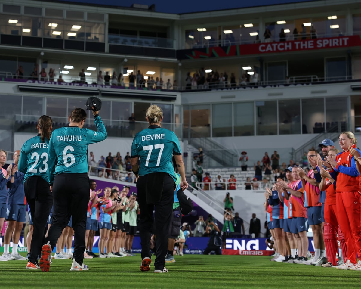 The soon-to-retire New Zealand cricketers Suzie Bates, Lea Tahuhu and Sophie Devine get a guard of honour from the England players and staff as they walk off the pitch at the Oval after a game in the Women's T20 World Cup.