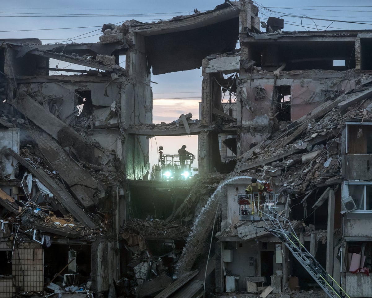 Ukrainian rescuers work at the site of a Russian missile strike on a nine-storey residential building in Kyiv, Ukraine.