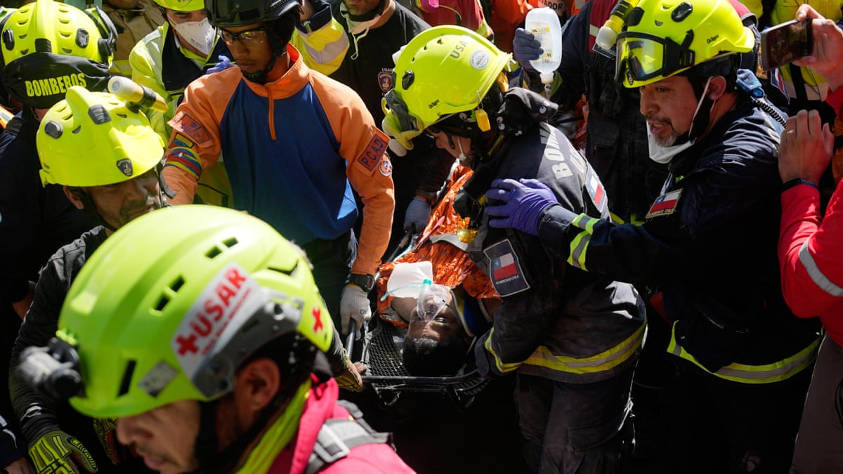Man pulled alive from collapsed Venezuela shopping centre eight days after earthquakes – video