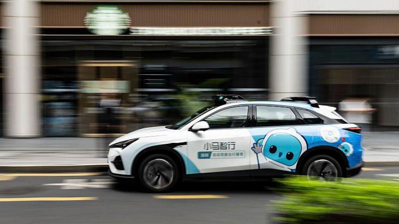 A Pony AI Inc. autonomous taxi travels along a road in Shenzhen, China