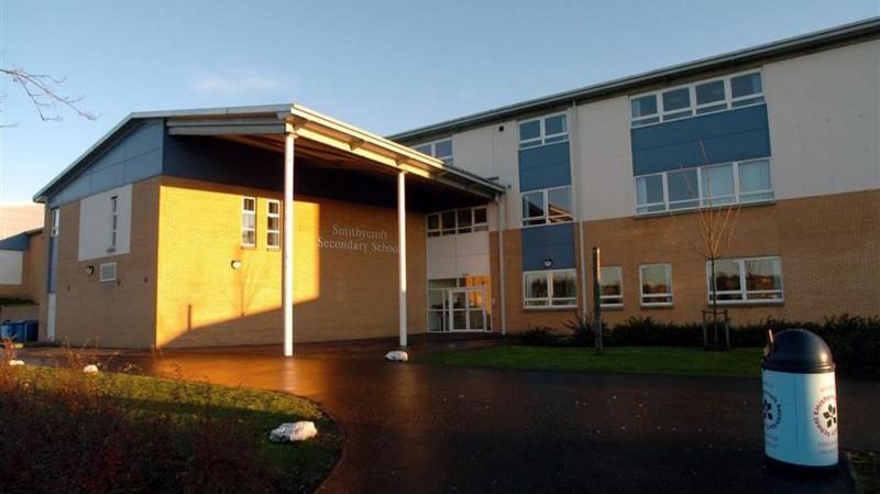 An exterior view of a large secondary school building