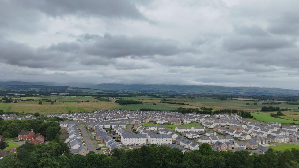 An aerial view of dozens of homes in the Robroyston area
