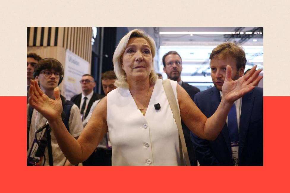 Marine Le Pen, President of the French far-right National Rally reacts during a visit at the 10th edition of the VivaTech technology startups and innovation fair