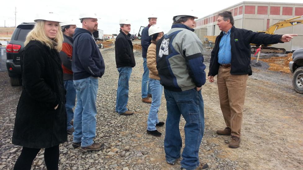 Paul Silvis, right, with staff at manufacturing business SilkoTek Corporation