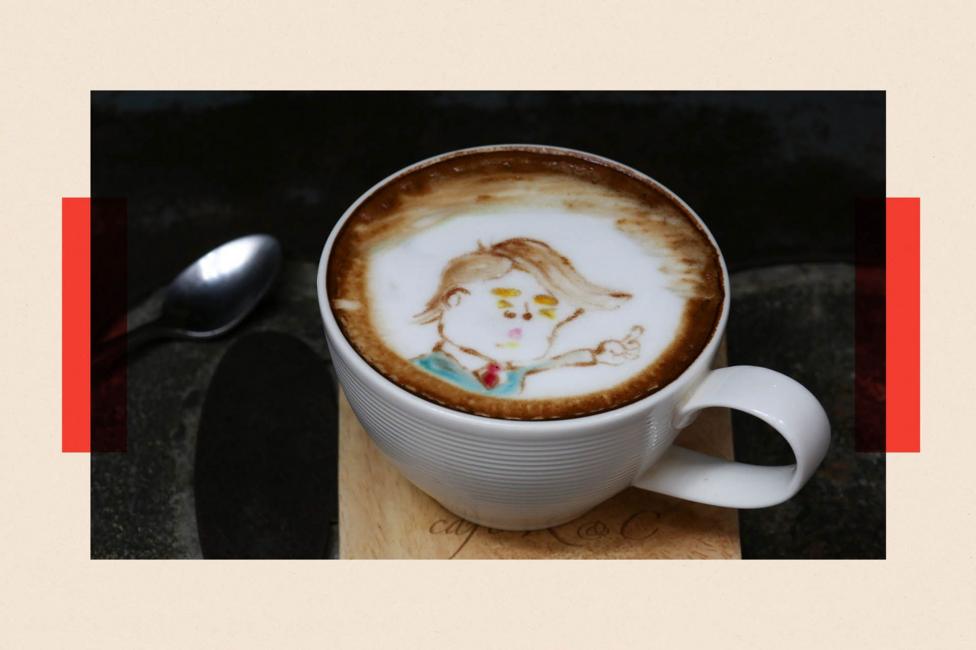 A coffee in a mug, with an imprint of Donald Trump in the foam