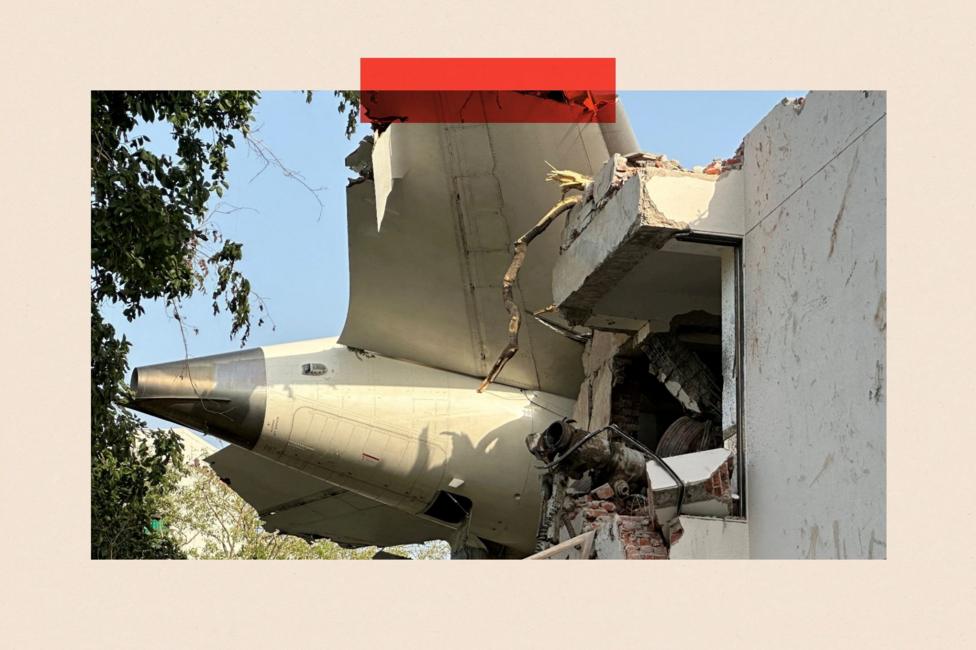 The tail of the aircraft through the edge of a building