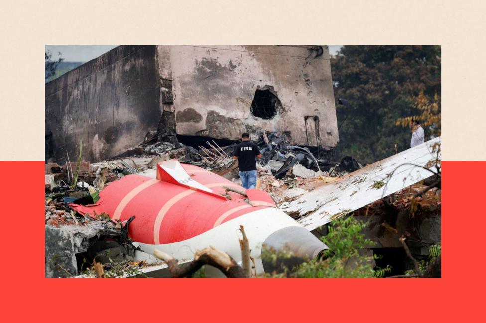 A firefighter stands next to the crashed Air India Boeing 787-8 Dreamliner aircraft