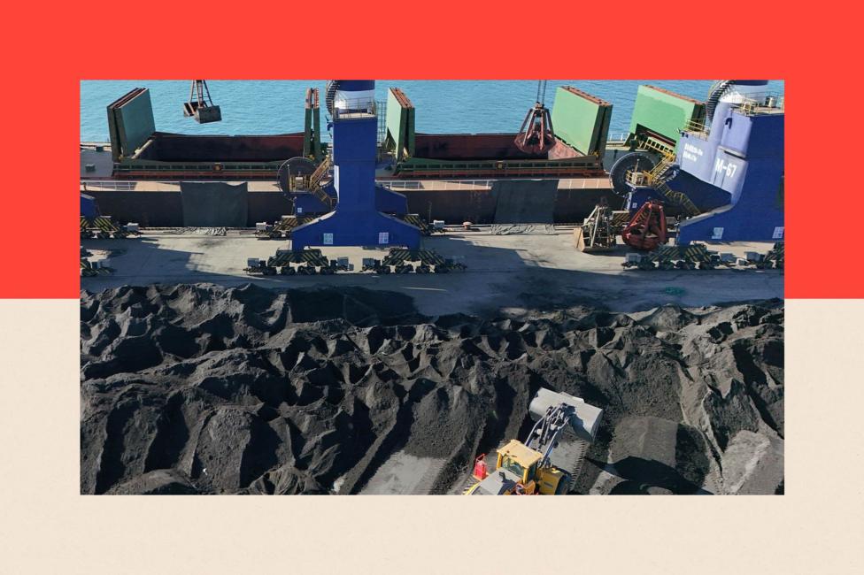 A batch of raw coal is being loaded onto a ship for shipment to a southern port from Yantai Port in Shandong Province, China 