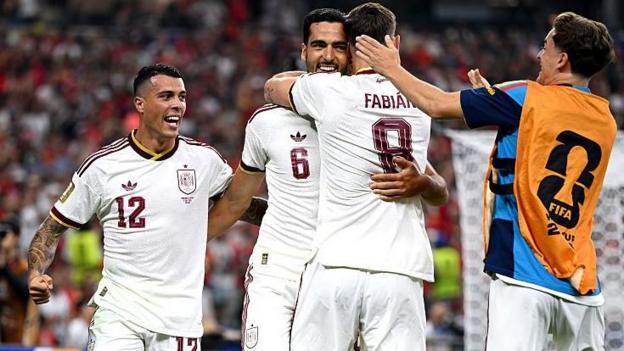 Mikel Merino #6 of Spain celebrates with team-mates after scoring his team's first goal