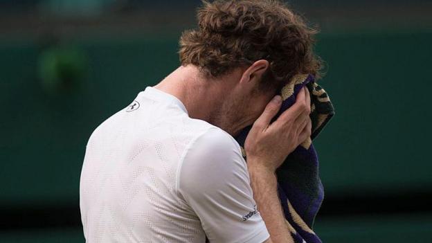 Andy Murray cries into his towel