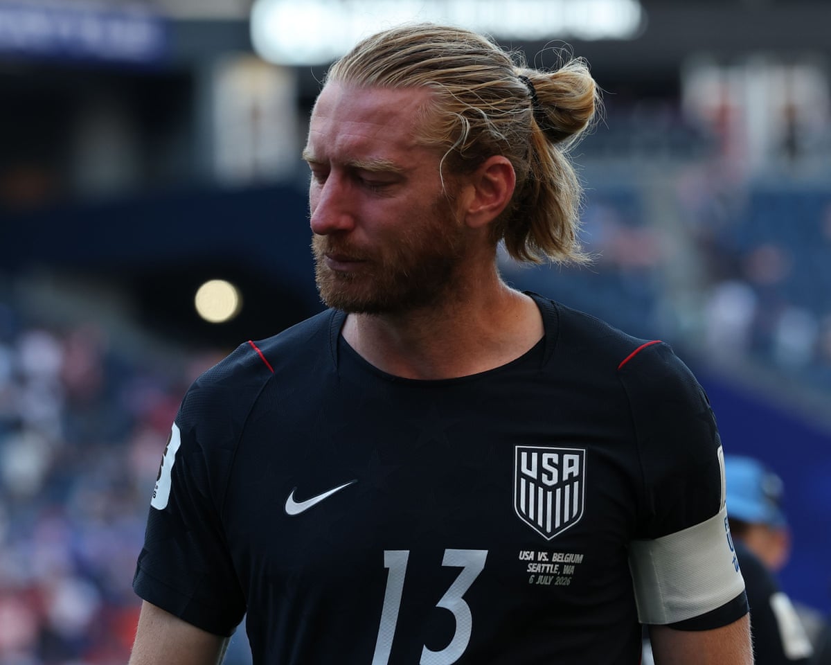 Tim Ream looks dejected on the pitch