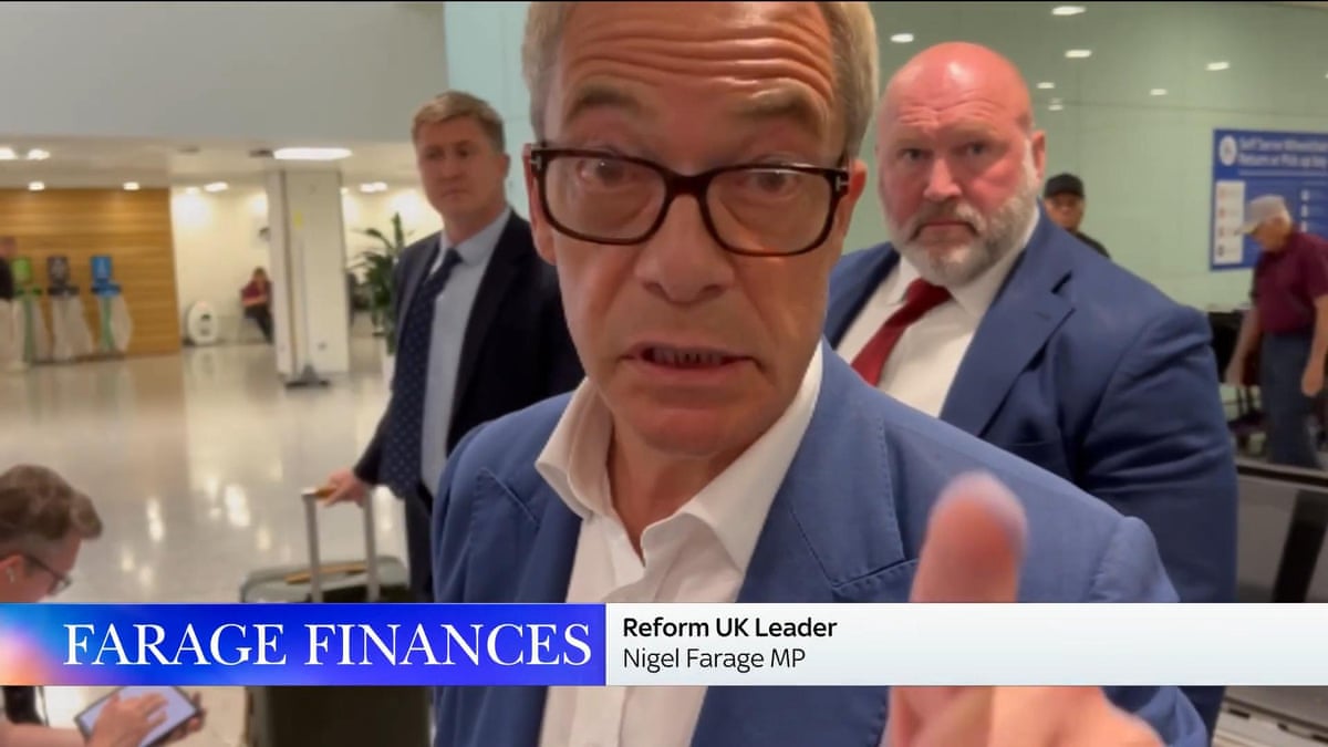 Nigel Farage confronts reporter after question over finances – video