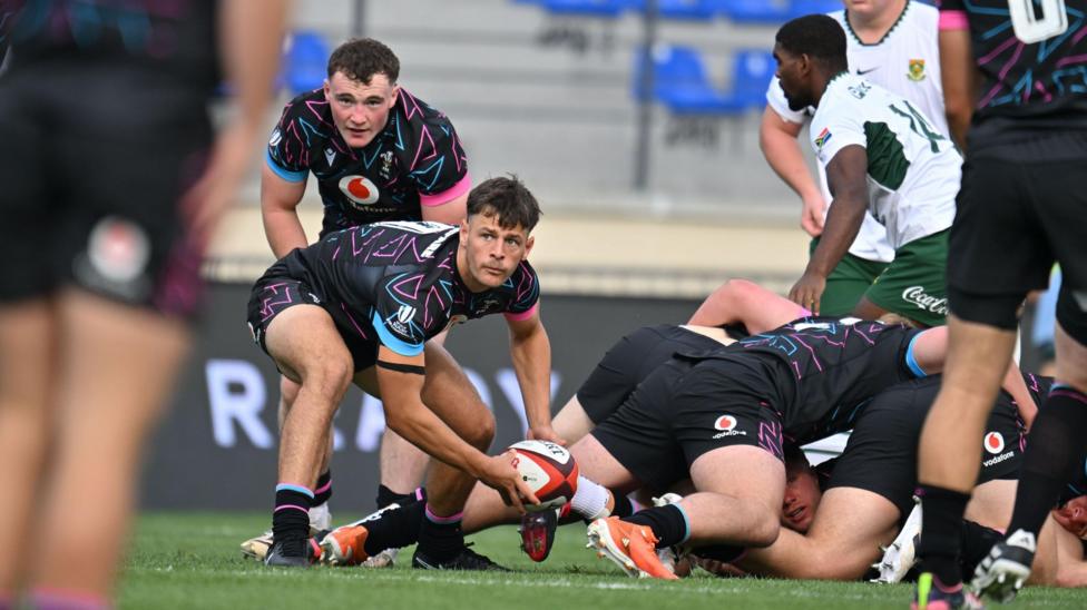 Scrum-half Sion Davies passes the ball for Wales against South Africa in the Junior World Championship