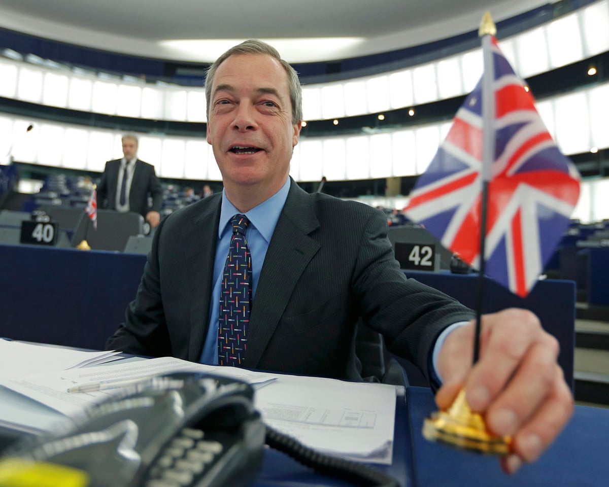 Farage placing a union flag on his desk