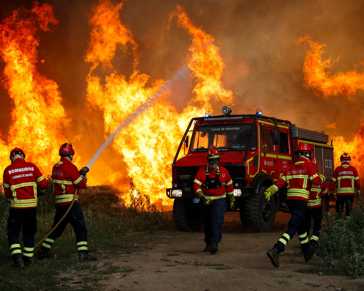 Firefighters tackle the Vouzela wildfire in Cercosa, Portugal, on Saturday.