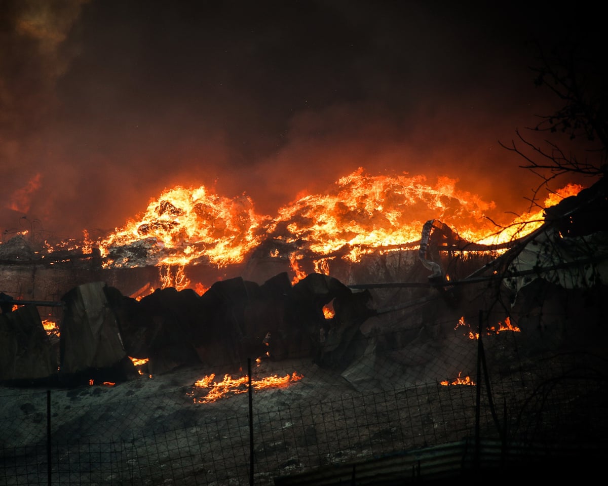 Smoke rises from a wildfire on the outskirts of Thessaloniki, Greece, on Sunday.