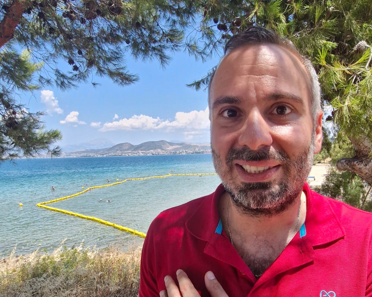 Antonis Spanos stood in front of the sea