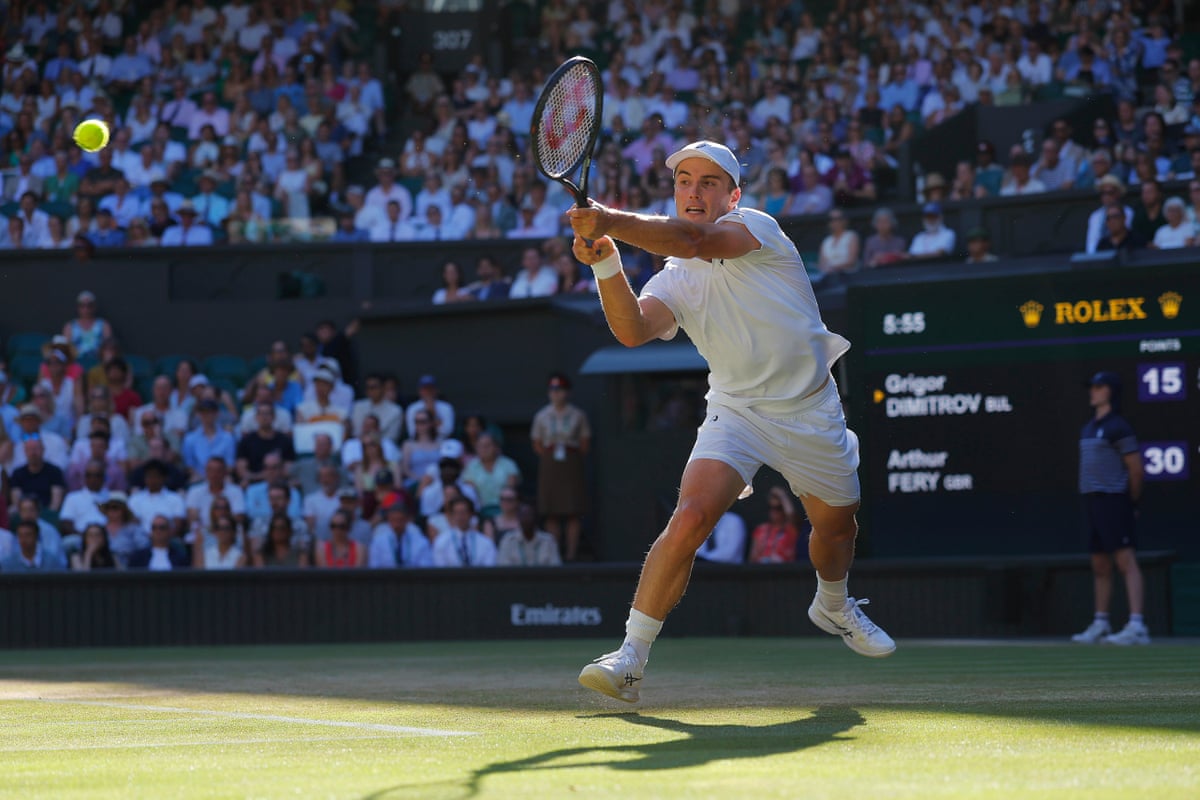 Arthur Fery uses a double-handed backhand and has both feet off the ground