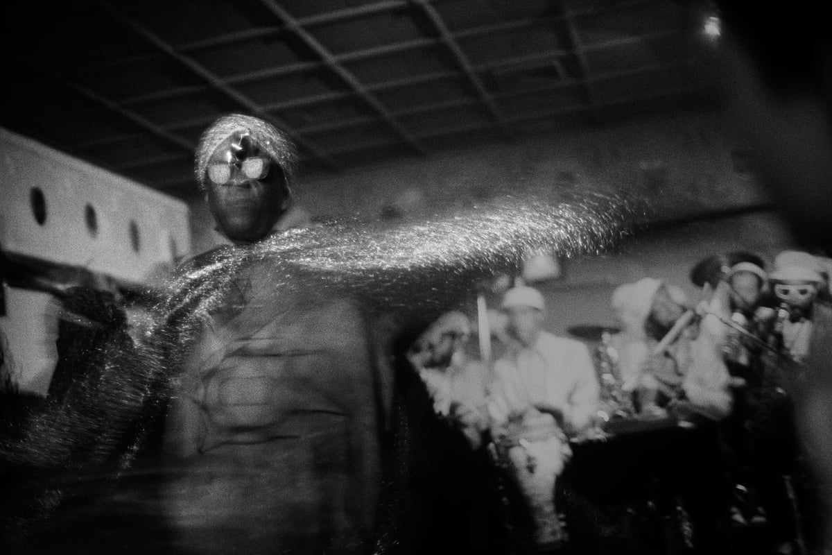 Sun Ra in silver cape, hat and sunglasses