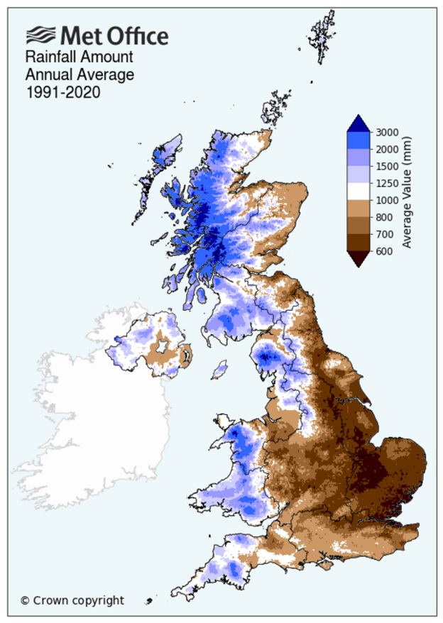 A Met Office map showing the UK with the annual average rainfall from 1991-2020. The East of England and Eastern Scotland are coloured in brown, which is the lower levels, with the West of Wales, Northern Ireland, England and Scotland in blue which is high.