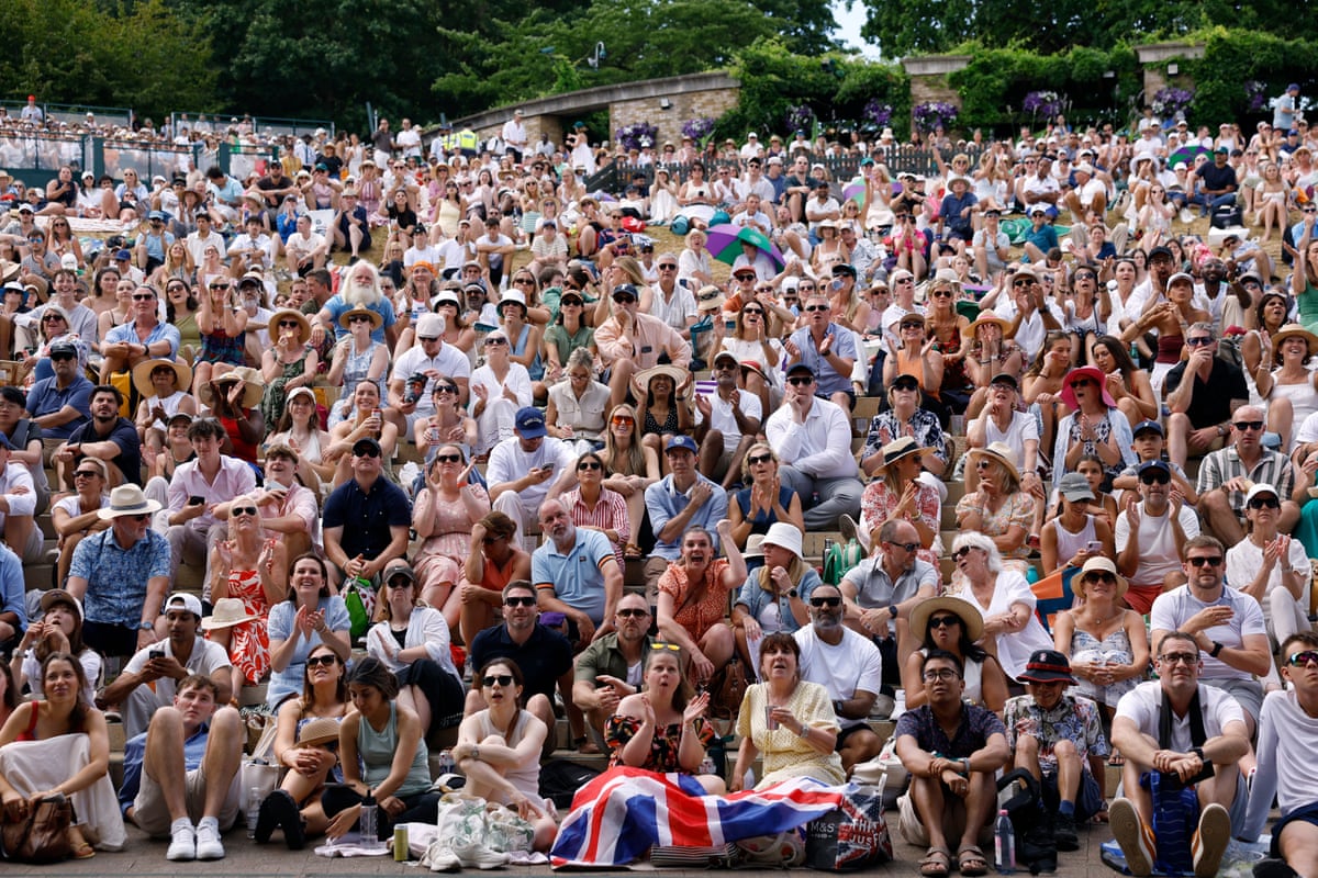 Spectators crowd on to Henman Hill to cheer on Arthur Fery.