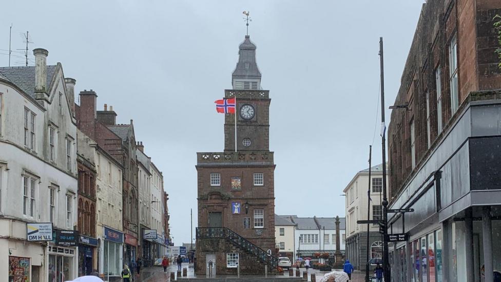 The Norwegian flag flying above the historic Midsteeple building in the heart of Dumfries