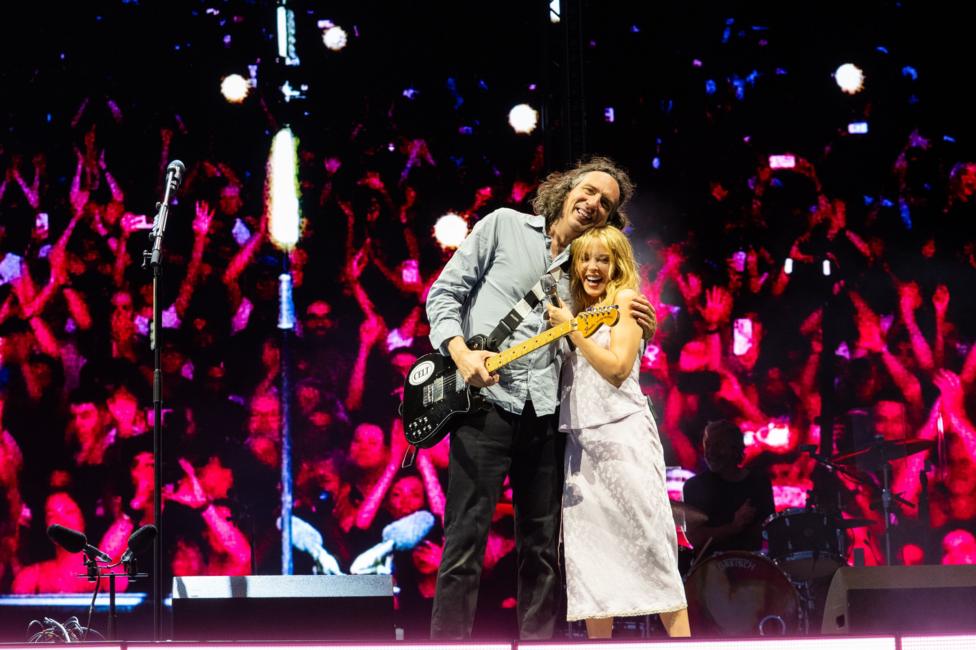 Kylie Minogue and Gary Lightbody hug on stage, after performing their song at Crystal Palace