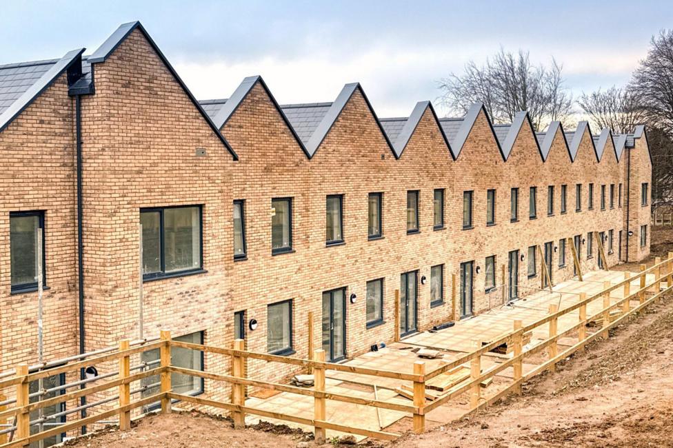 A row of terraced houses is under construction