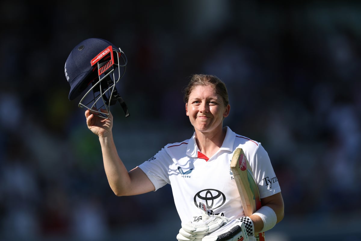 Heather Knight acknowledges the crowd holding her helmet in the air after her final innings during day three at Lord’s