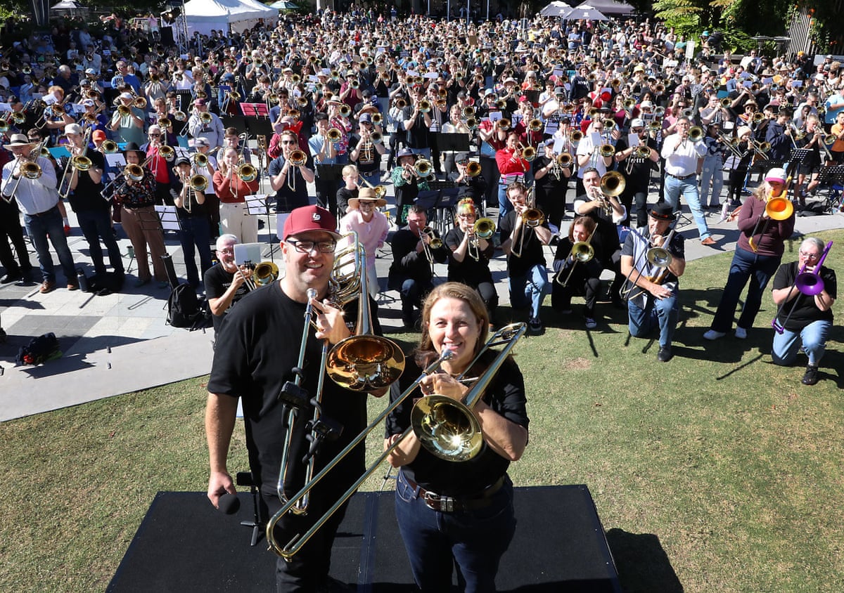 Ipswich City Big Band Music Director Matt Chambers and Ipswich Mayor Teresa Harding at the World Record Attempt for most trombones playing a song at one time in Tulmur Place for SPARK Ipswich Arts Festival