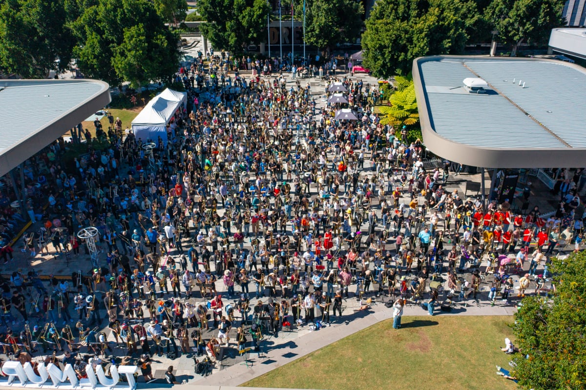 An aerial shot of hundreds of trombonists