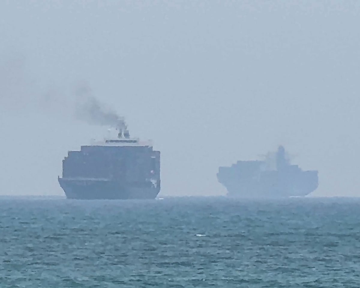 Cargo ships anchoring near the strait of Hormuz off the UAE’s eastern coast on Sunday.