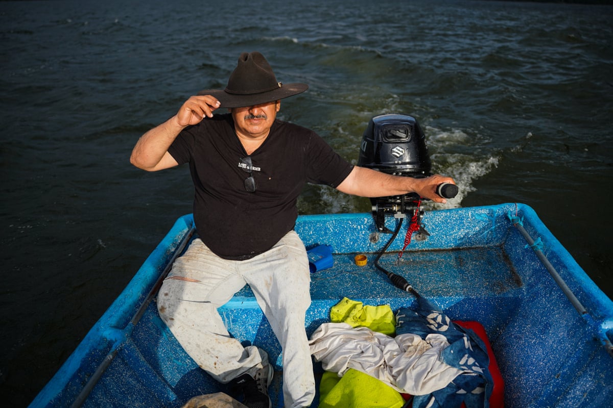 A middle-aged man in a fedora hat