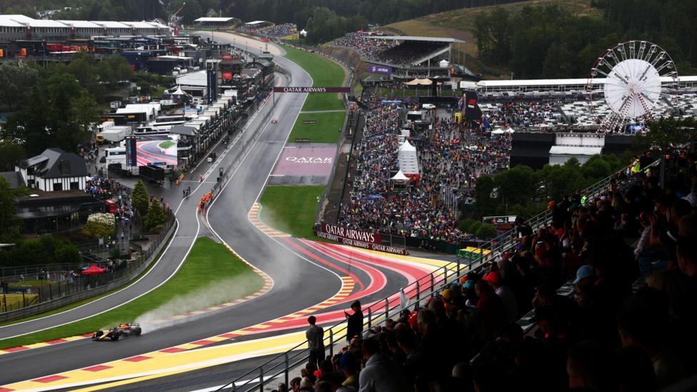 Red Bull's Max Verstappen drives his Red Bull up the Eau Rouge corner in wet conditions during practice for the 2024 Belgian Grand Prix