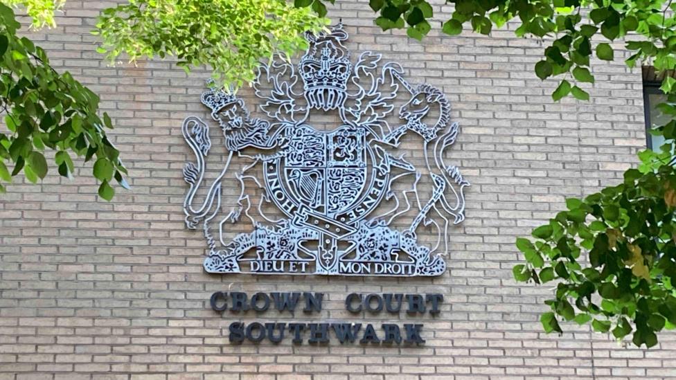 A general view of a crown court sign on the side of a building. It reads Crown Court Southwark.
