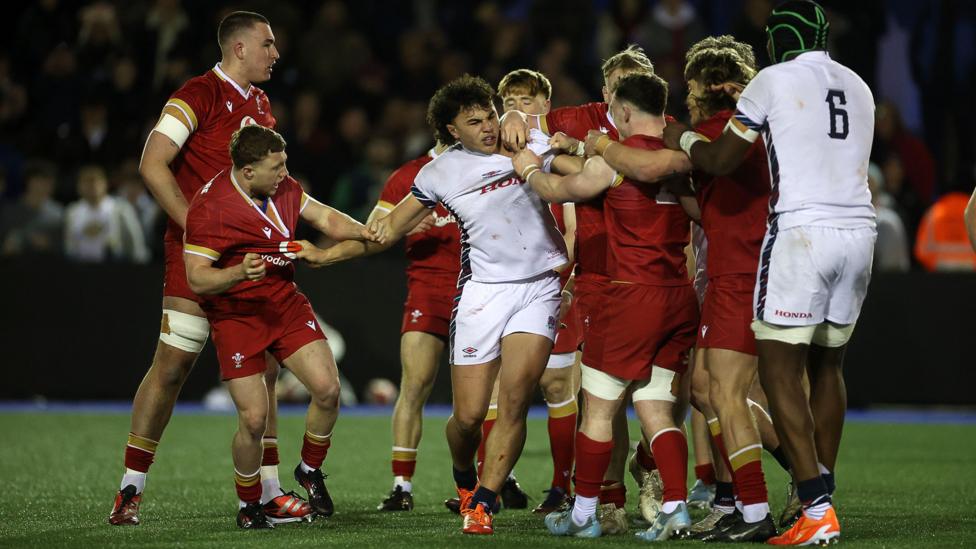 Kane James (centre) in action for England U20s against Wales
