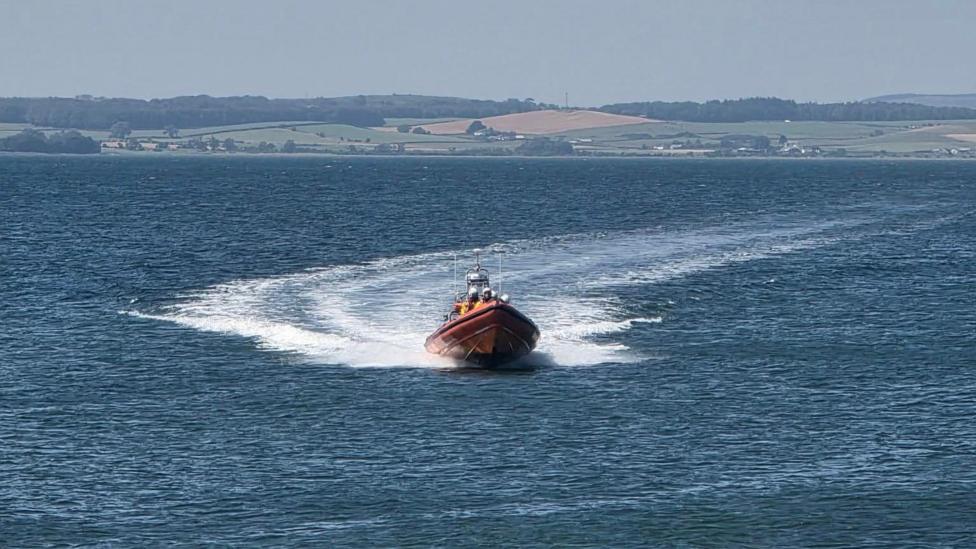 A lifeboat and crew out on the open water
