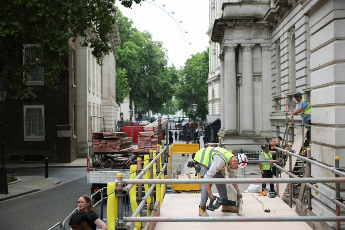 Workmen erecting platforms in Downing Street this morning, for use by the media on Monday when Andy Burnham will become PM.