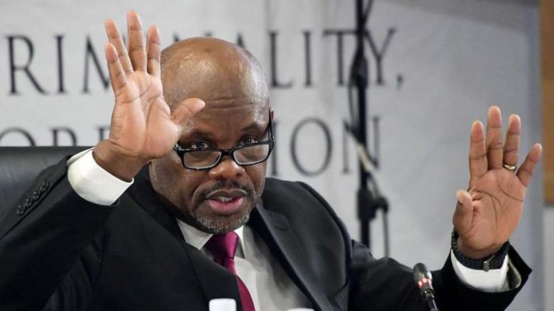 Police boss Shadrack Sibiya is seen with his hands up as he testifies at a public inquiry investigating police corruption