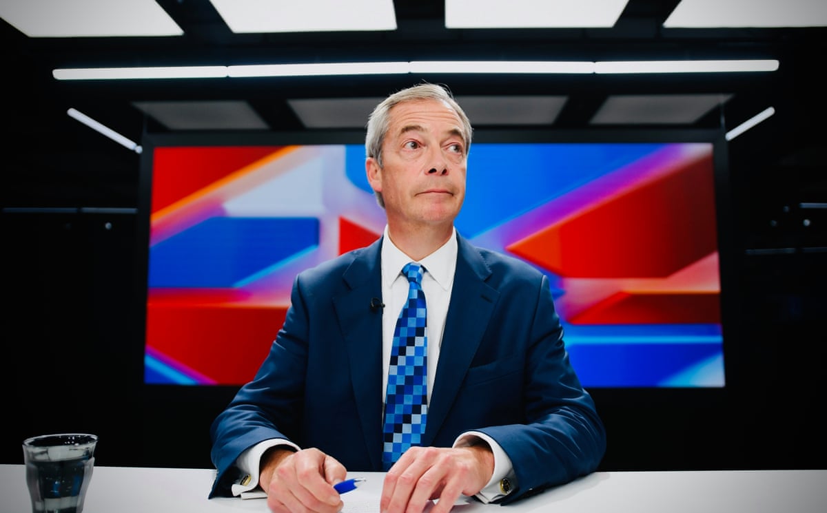 Nigel Farage in the studio presenting his GB News show