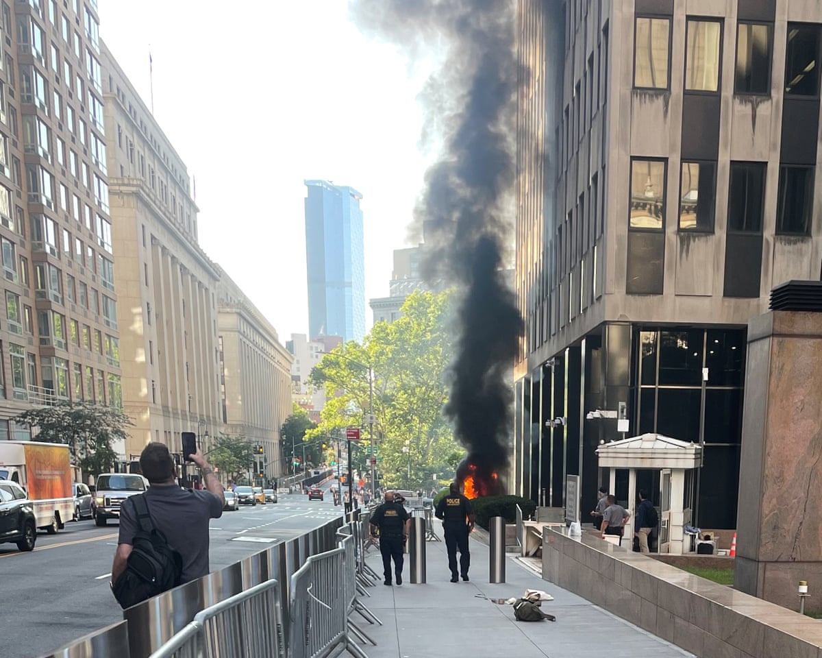 Black smoke and flames in front of 26 Federal Plaza in lower Manhattan, after an incendiary device was deployed, 20 July 2026.