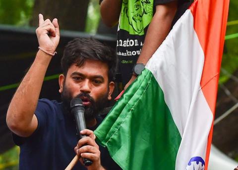 Abhijeet Dipke addresses protesters as demonstrators take part in a protest organised by the Cockroach Janta Party (CJP) at Jantar Mantar during the opening day of Parliament's Monsoon Session on July 20, 2026 in New Delhi, India.