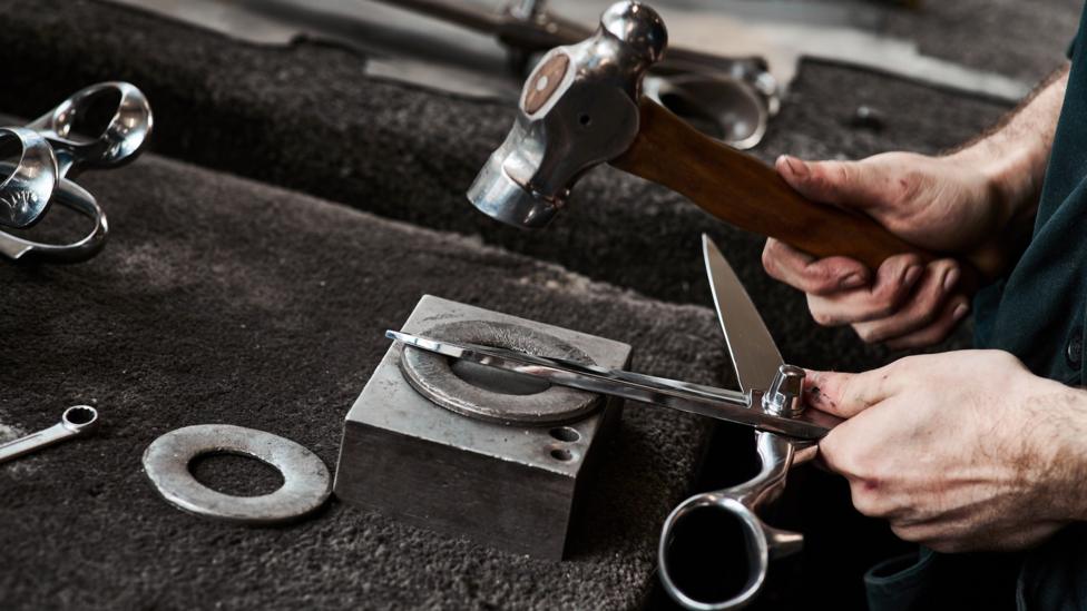 A worker at Ernest Wright puts finishing touches to a pair of shears.