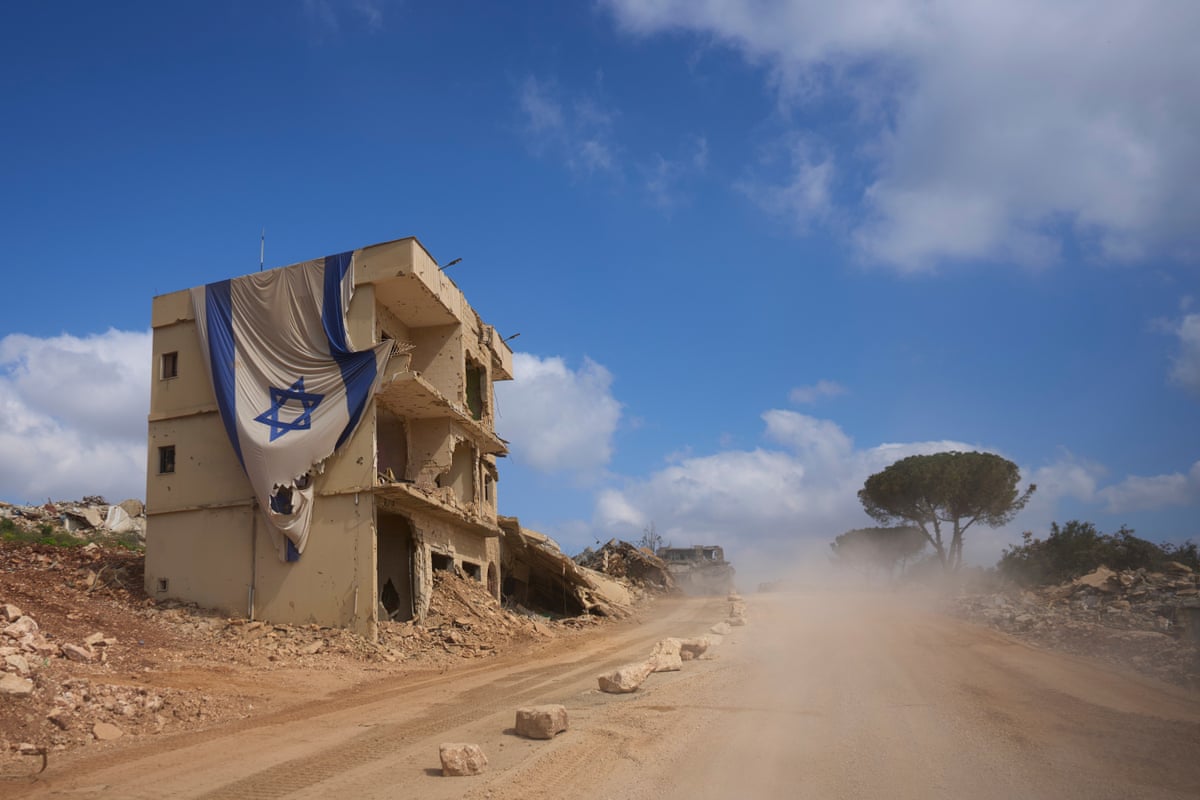 An Israeli flag hangs from a building in an area occupied by Israeli troops in southern Lebanon.