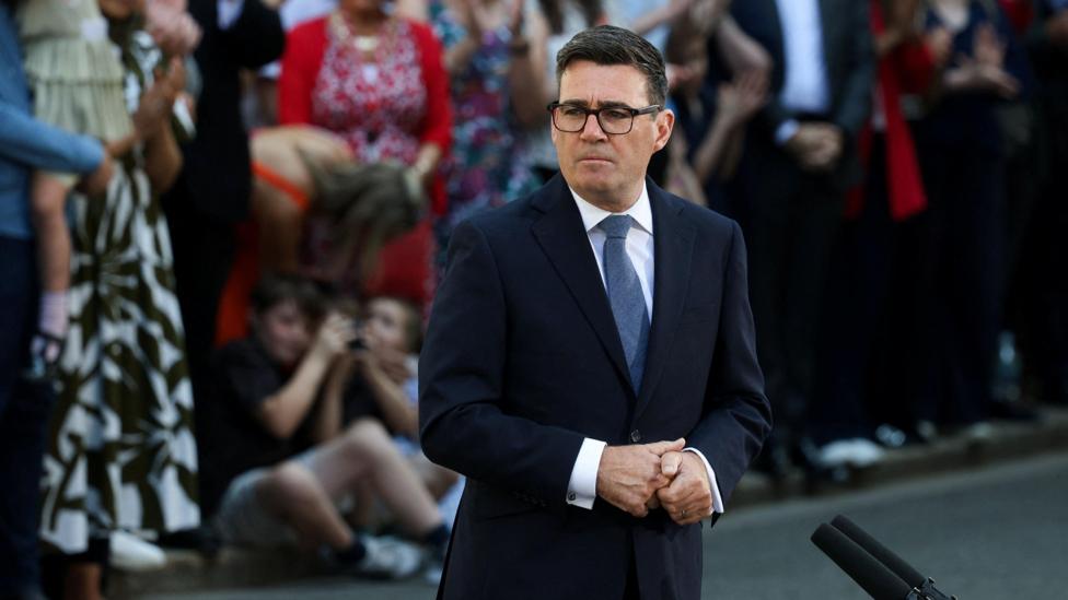 Prime Minister Andy Burnham outside Number 10 Downing Street on his first day in the job.