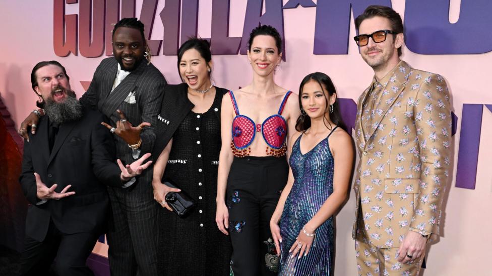 Kaylee Hottle stands alongside her cast members Adam Wingard, Brian Tyree Henry, Fala Chen, Rebecca Hall and Dan Stevens at the premiere of Godzilla X Kong: The New Empire.