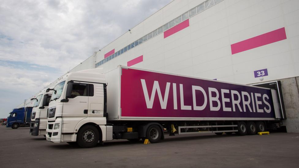 A picture of a lorry with Wildberries written on the side