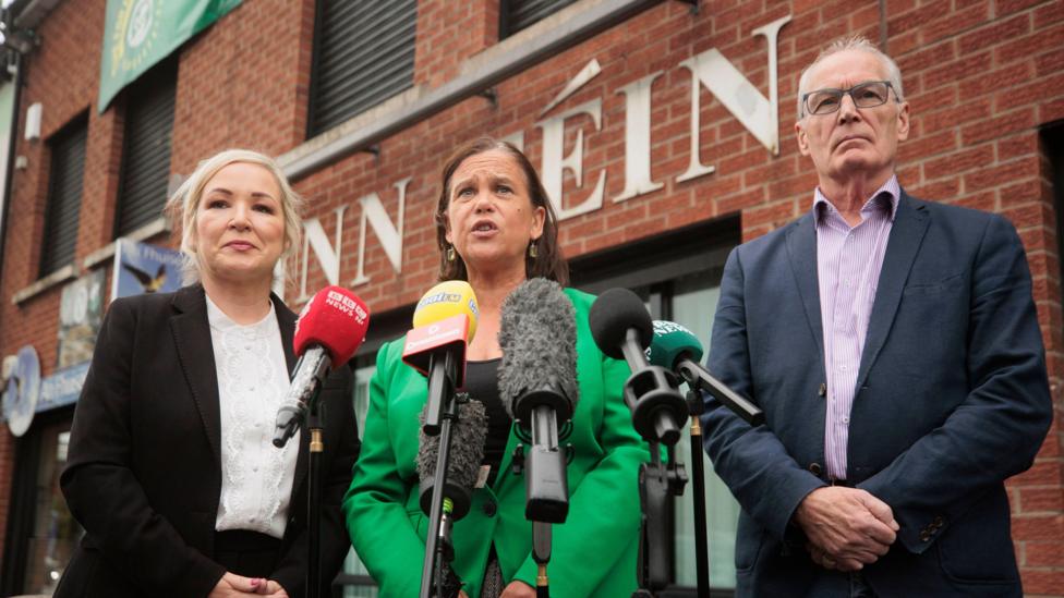 Sinn Fein President Mary Lou McDonald TD (centre), with First Minister Michelle O'Neill (left) and Gerry Kelly MLA (right), speaking to the media outside the Sinn Fein offices in Belfast in September 2025