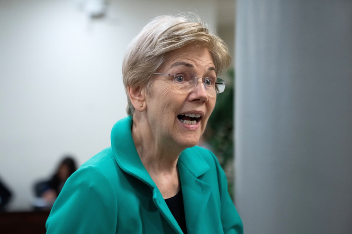 Senator Elizabeth Warren wearing a green jacket